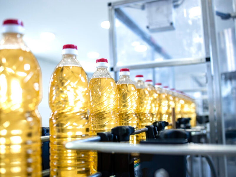 bottled-vegetable-oil-conveyor-automated-machine-being-produced-food-production-plant